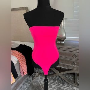 Hot pink body suit